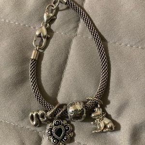 Brighton charm bracelet with heart green stone, dog, initial G charms.